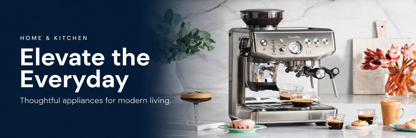 A stainless steel espresso machine and coffee cups on a bright kitchen counter. The navy banner reads Home & Kitchen: Elevate the Everyday. Thoughtful appliances for modern living.